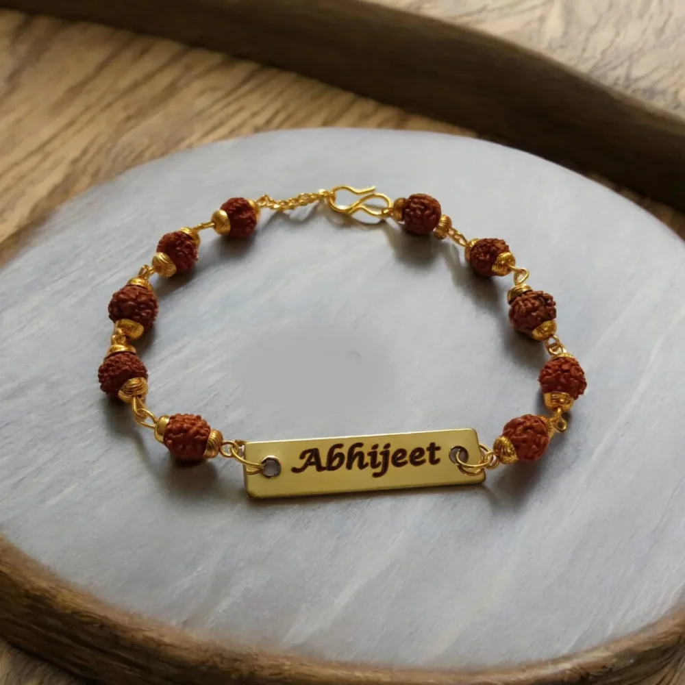 Personalised rudraksha rakhi with engraved name on gold plate