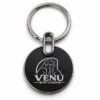 Circle metal keychain with a pet shop logo
